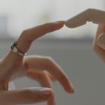 A human hand reaching toward a robotic hand
